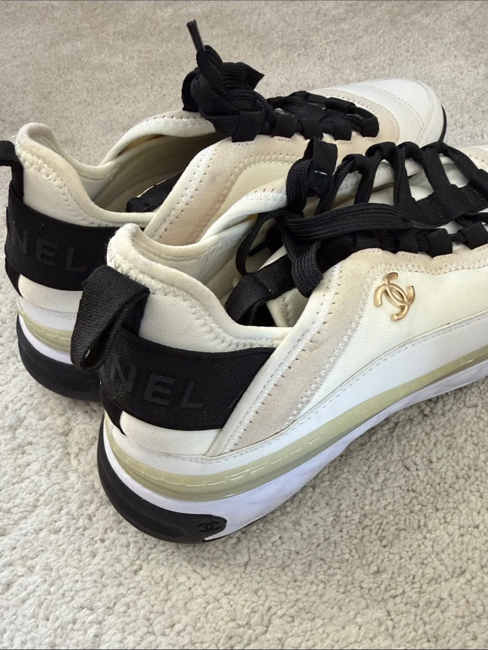 CHANEL Women’s Sneakers in White, Black and Cream